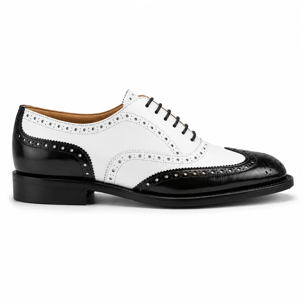Crockett & Jones classic wingtip oxford shoe featuring a two-tone black and white leather design, with black laces and a black stacked heel, shown in a side profile on a white background.