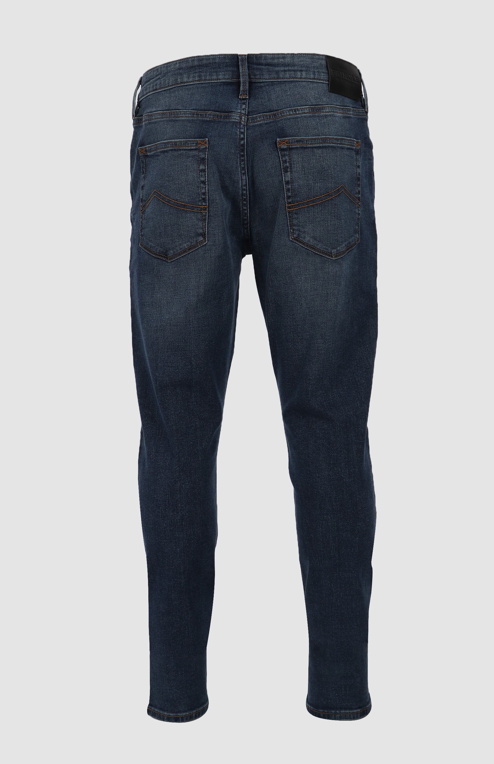 Shop the timeless Peter Denim Jeans in medium blue. Featuring a straight-leg fit, five-pocket design, and premium branded details. Made from a durable, eco-friendly fabric blend for everyday wear. Available in-store at 337 Monty Naicker Street, Durban Central, or at www.omarstailors.com.