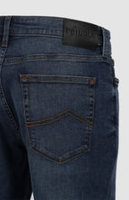 Shop the timeless Peter Denim Jeans in medium blue. Featuring a straight-leg fit, five-pocket design, and premium branded details. Made from a durable, eco-friendly fabric blend for everyday wear. Available in-store at 337 Monty Naicker Street, Durban Central, or at www.omarstailors.com.