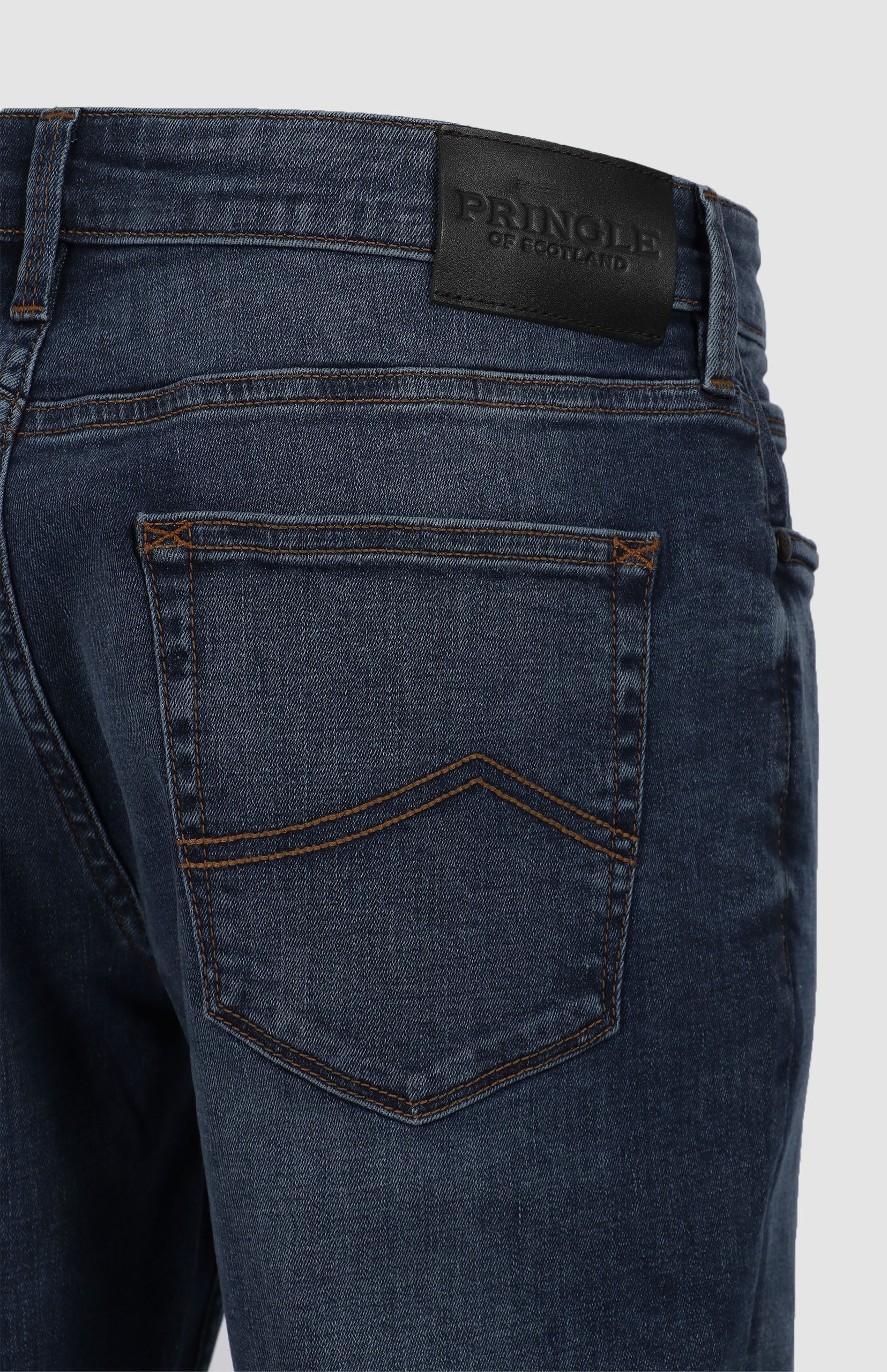 Shop the timeless Peter Denim Jeans in medium blue. Featuring a straight-leg fit, five-pocket design, and premium branded details. Made from a durable, eco-friendly fabric blend for everyday wear. Available in-store at 337 Monty Naicker Street, Durban Central, or at www.omarstailors.com.