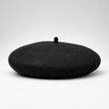 Black beret on a white background