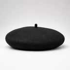 Black beret on a white background