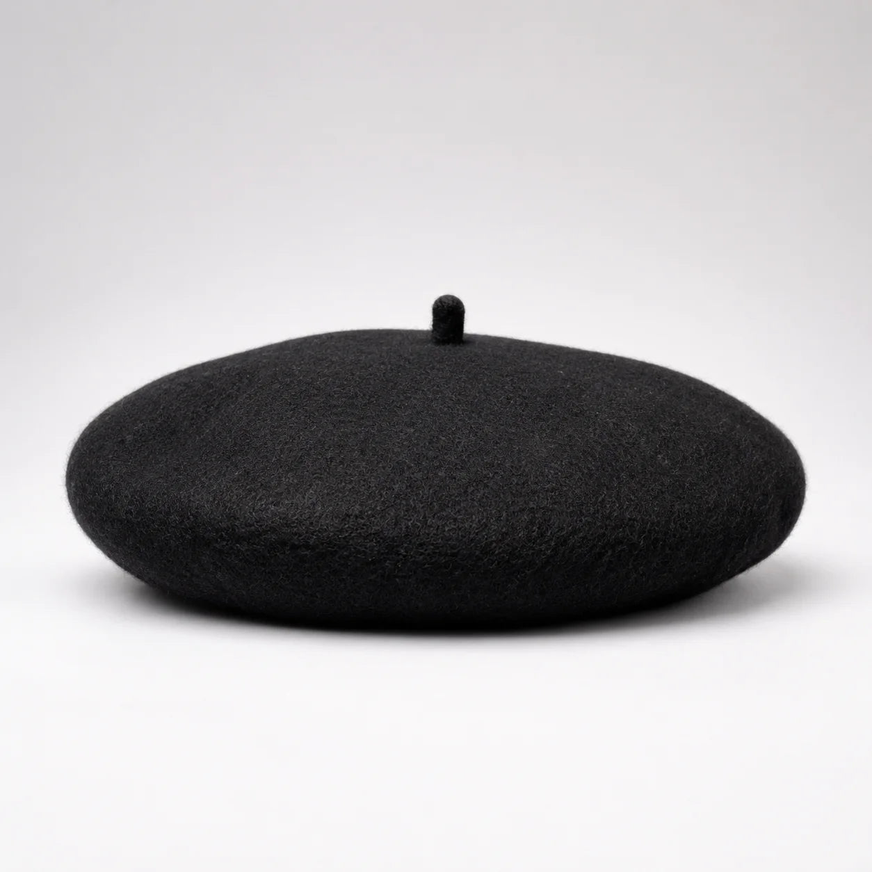 Black beret on a white background