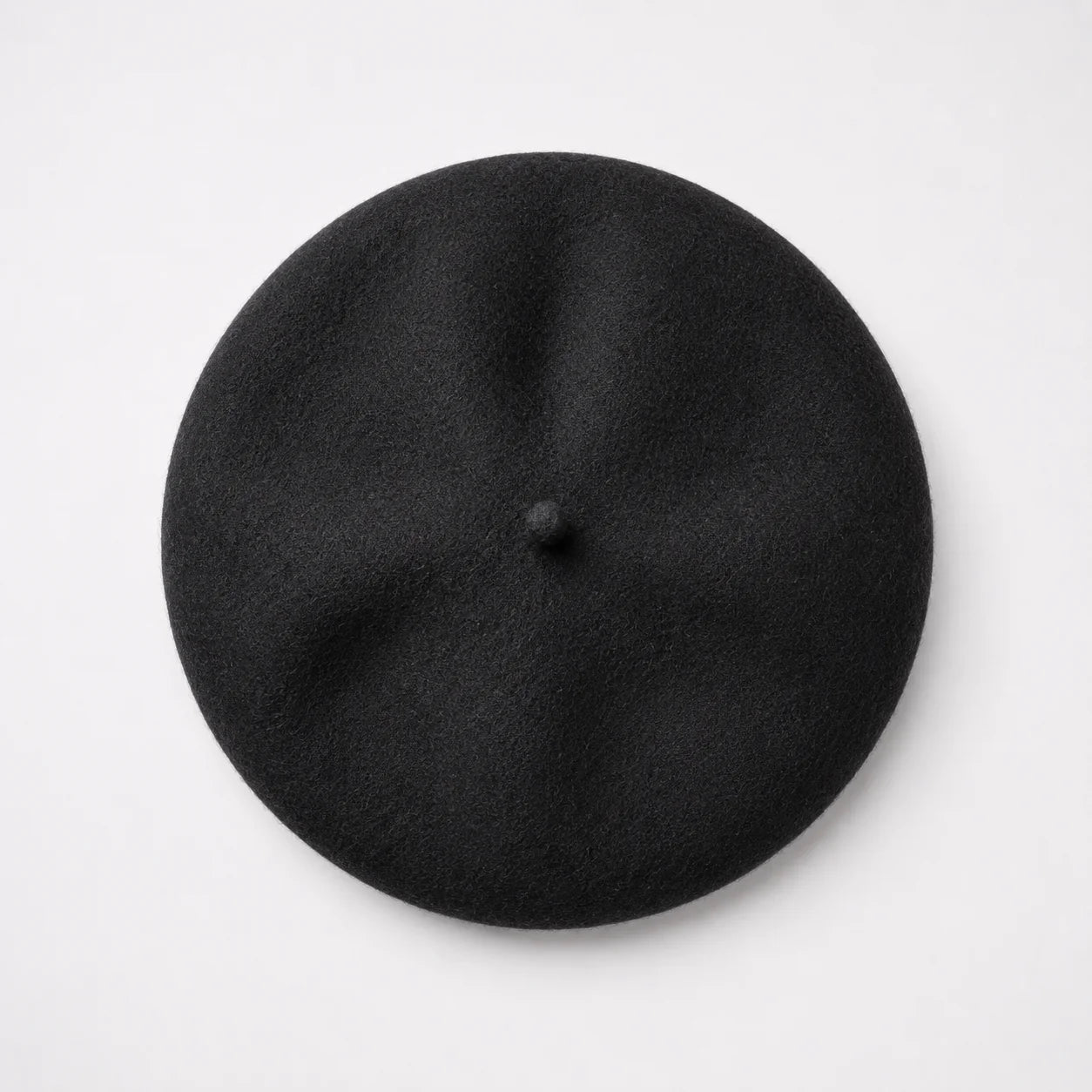Black beret on a light gray background
