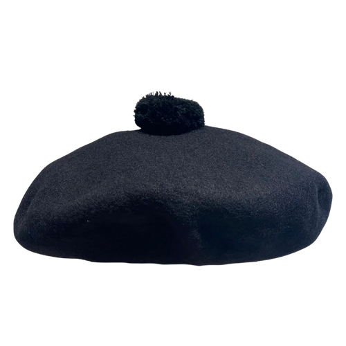 Black beret with a pom-pom on a white background