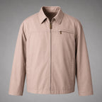 A light beige utility jacket with a full front zipper, pointed collar, and a zippered chest pocket, shown against a neutral gray background.