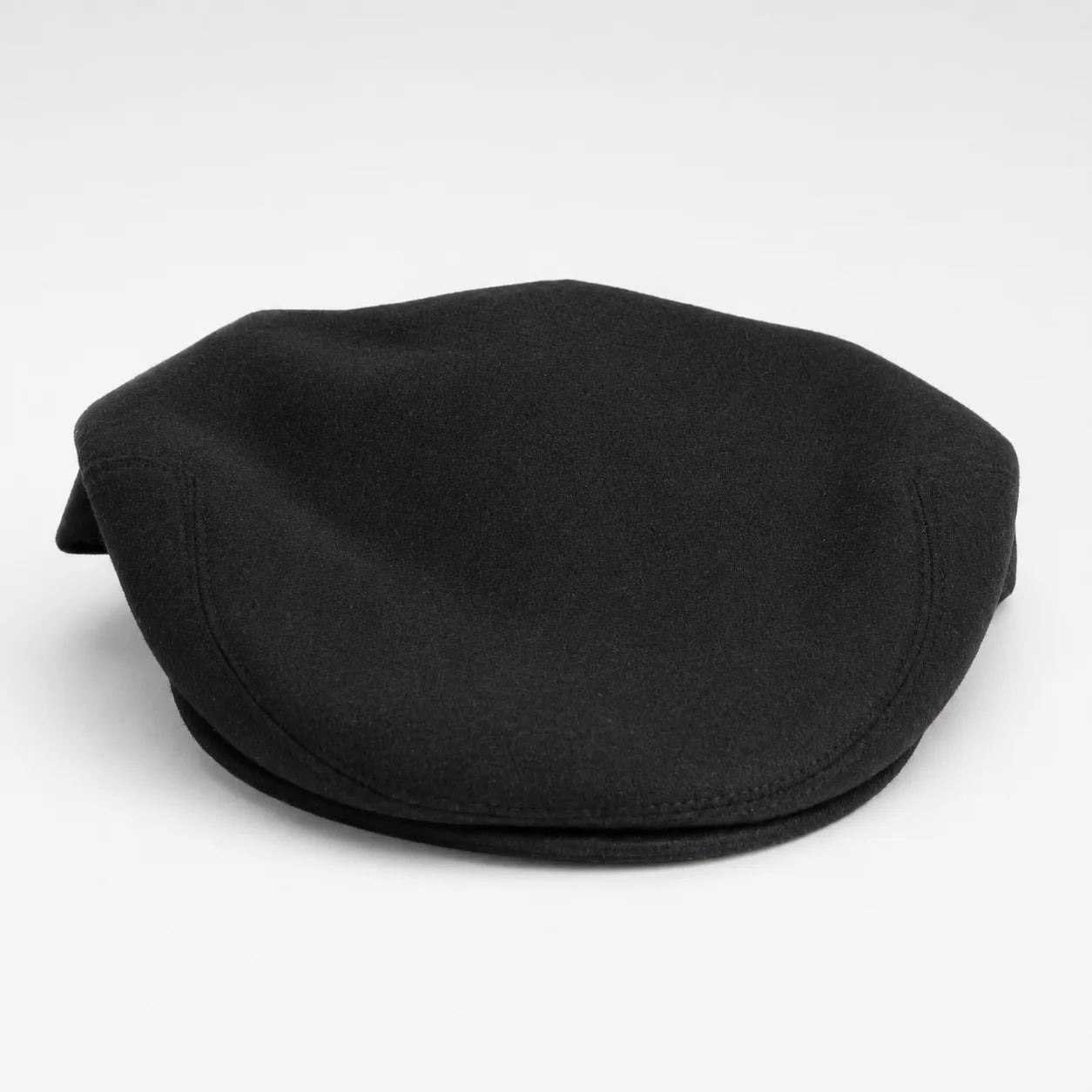 Men's Navada Felt Flat Cap in Black is available in-store or online at Omar's Tailors & Outfitters in-store or online at www.omarstailors.com