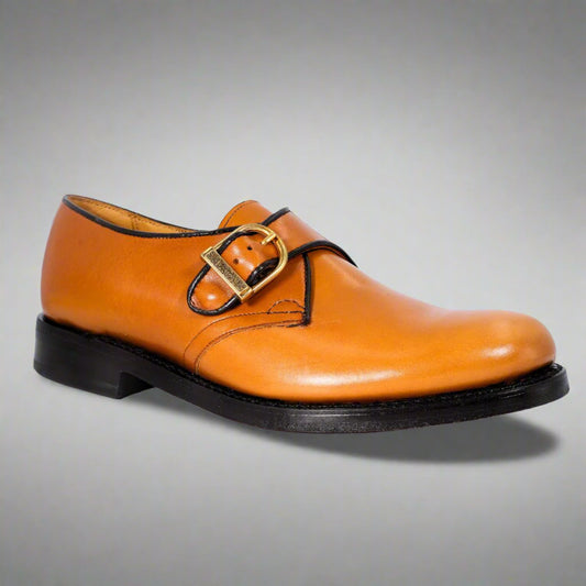 A pair of Saxone French Calf Buckle shoes in calf color with a buckle-up closure, featuring a genuine leather upper and sole.