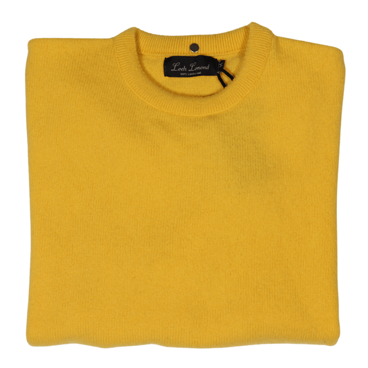 Stay warm and stylish with the Loch Lomond 100% lambswool long-sleeve jersey in Yellow (3696). Made from premium lambswool, this jersey offers both comfort and durability. Perfect for chilly days and evenings, it's a versatile addition to any wardrobe. Shop in-store at 337 Monty Naicker Street, Durban or online at www.omarstailors.com